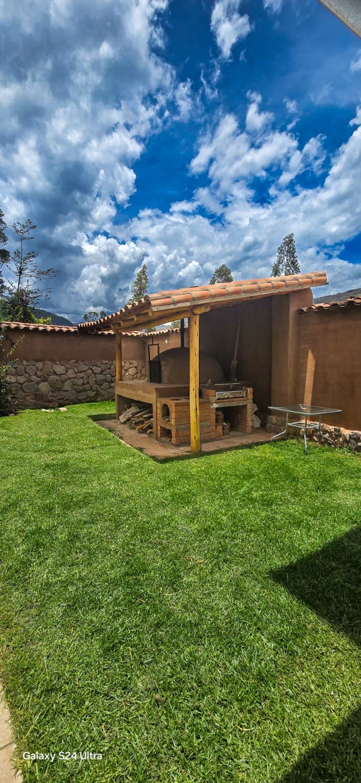 Outdoor BBQ area with garden views